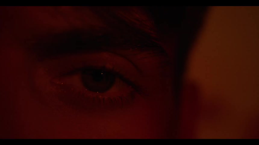 Close up of a person opening their eye
