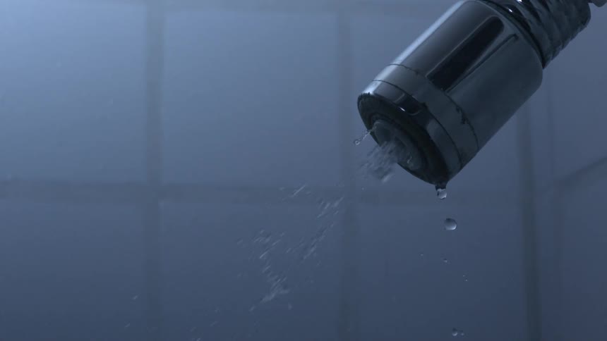 Slow motion view of water spraying from a shower head
