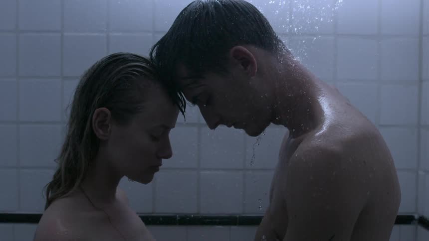 A man and woman taking a shower
