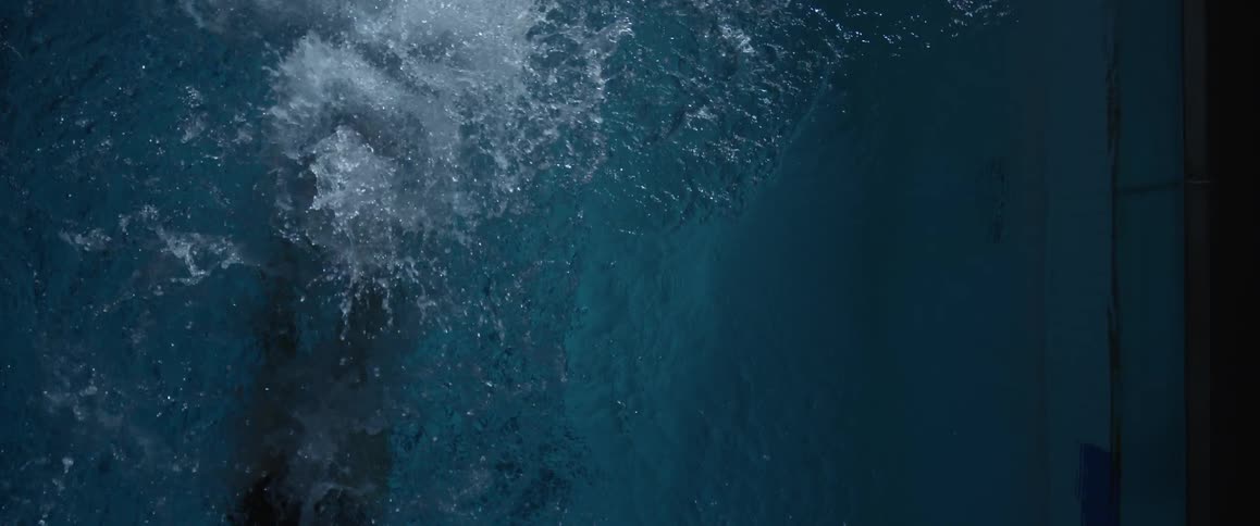 A man swimming in a pool