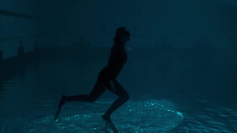 A woman suspended underwater