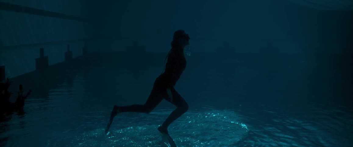 A woman suspended underwater