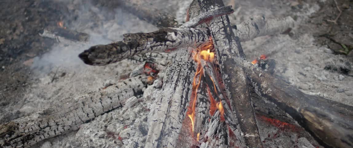A campfire burning and smoking