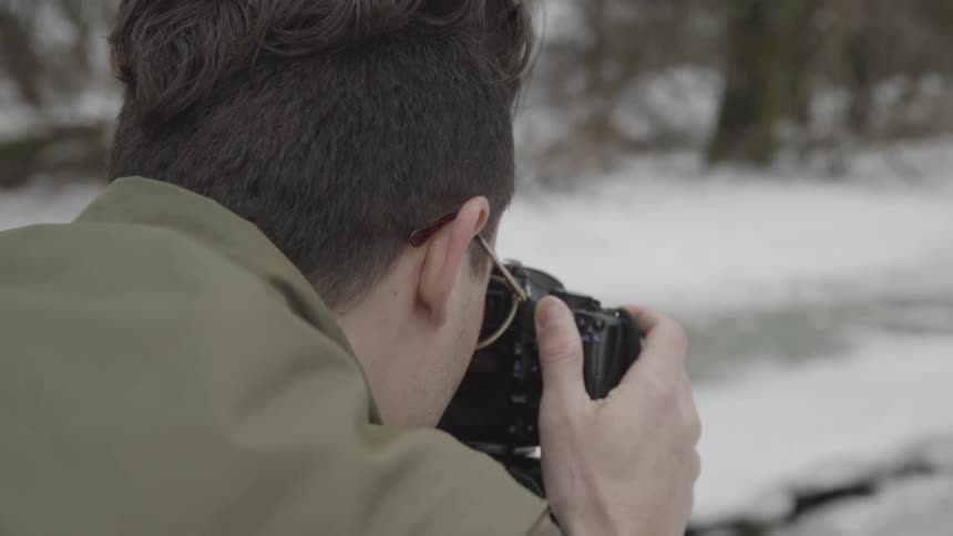 Man Taking Photos In Winter