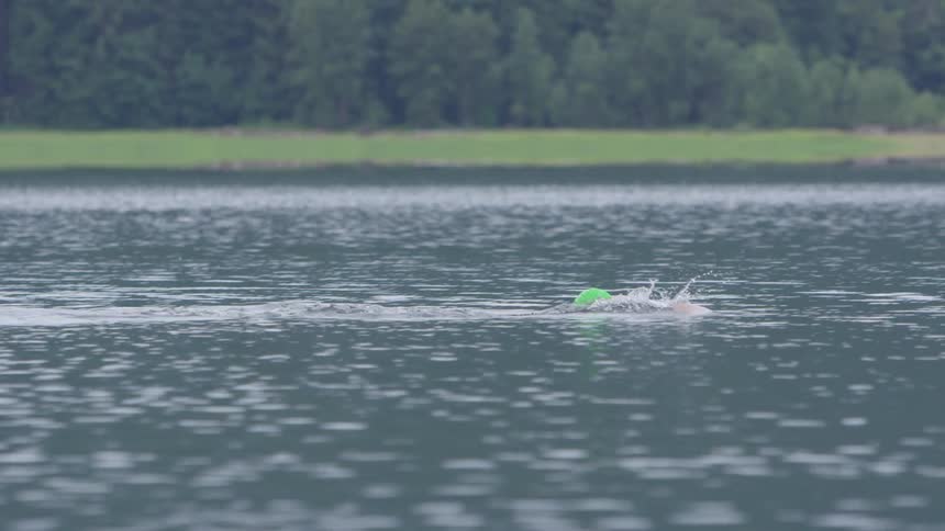 Man Swimming In Lake