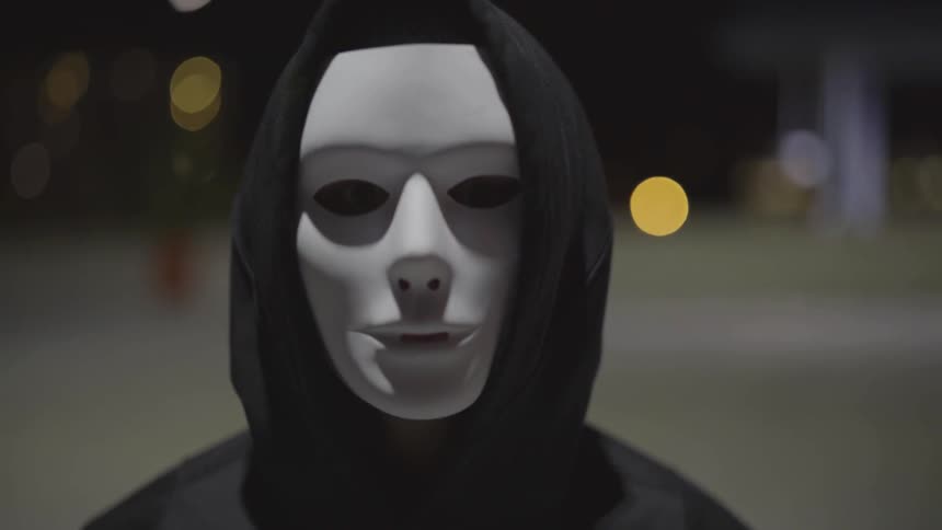 Man Wearing Mask With A Gun At Night