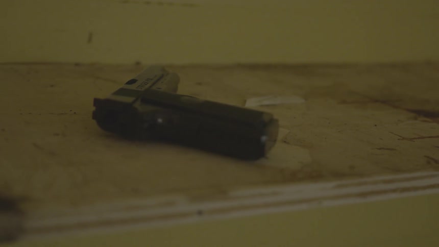 Man With Gun In Abandoned House