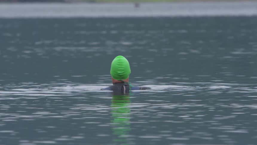 Man Swimming In Lake