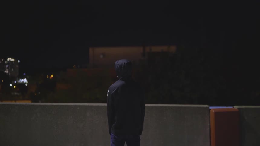 Man Wearing Mask With A Gun At Night