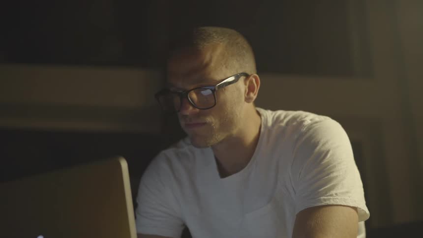Man With Glasses Using Computer