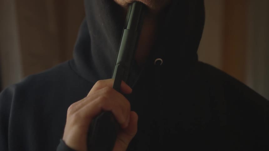 Man With Gun In Abandoned House