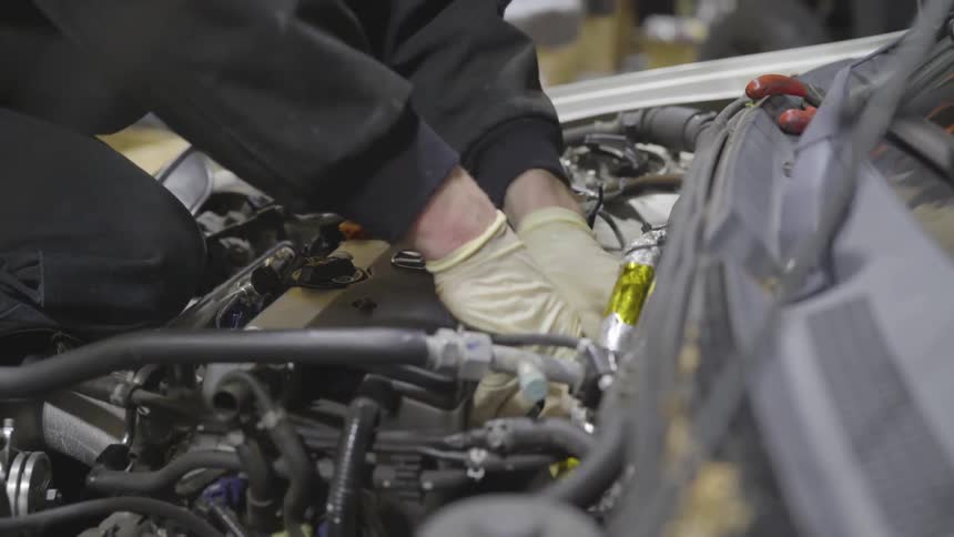 Mechanic Working On Car