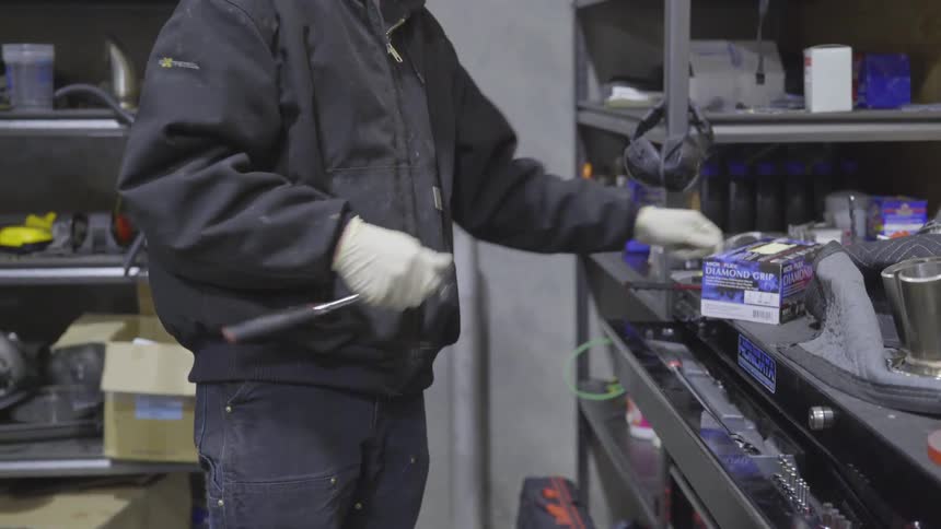 Mechanic Working On Car