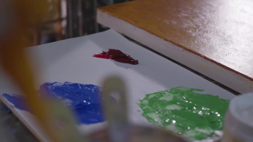 Older Man Painting In Studio