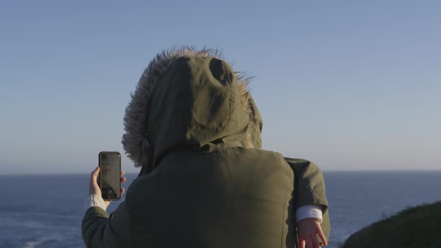 Mother And Daughter Visit Beach
