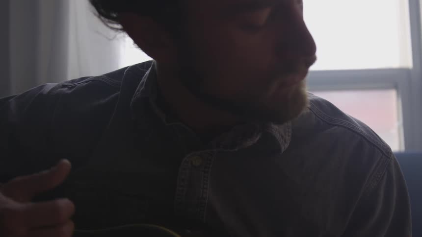 Musician In Small Apartment In New York City