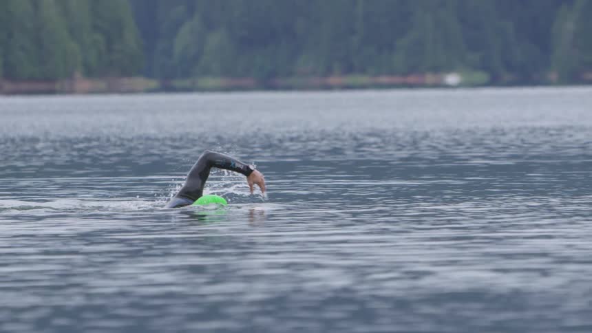 Man Swimming In Lake