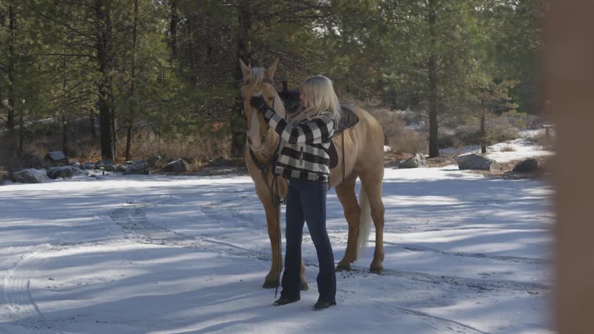 People Riding Horses In Snow