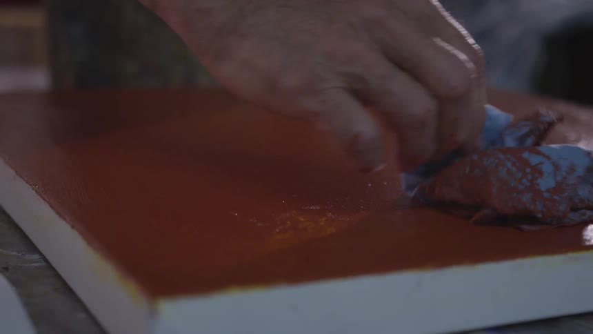Older Man Painting In Studio
