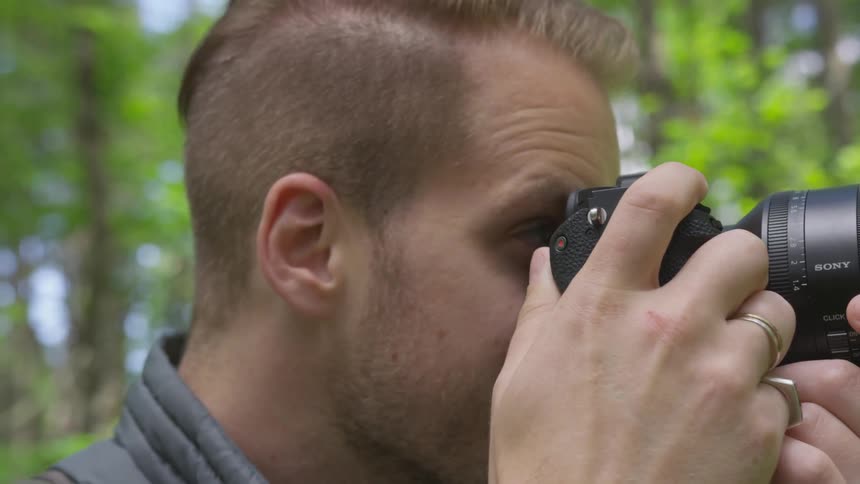 Photographer Hiking In Nature