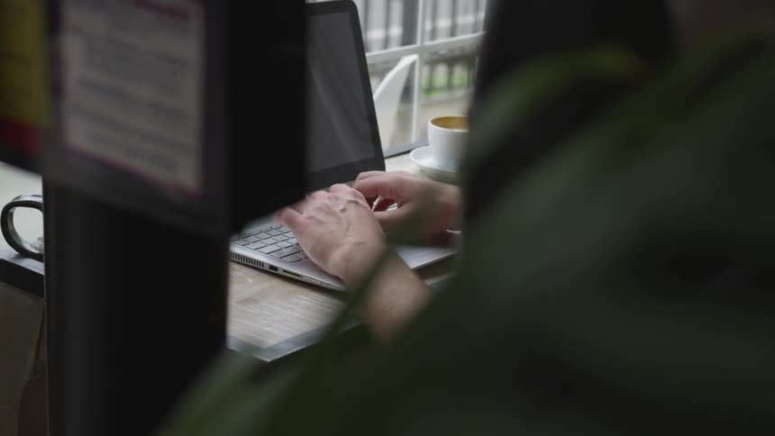 Man Working At Coffee Shop