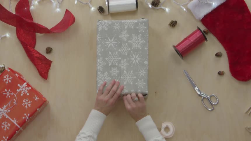 Person Wrapping Gifts