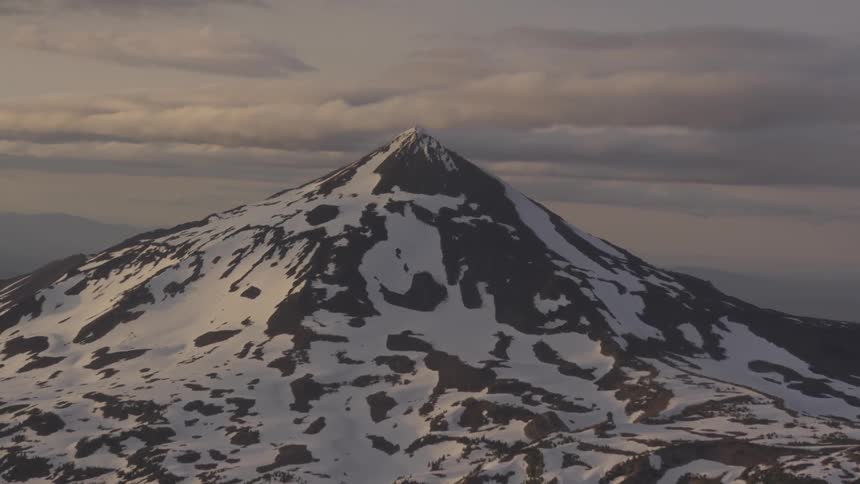 Pilot Flying Plane Through Snowy Mountains