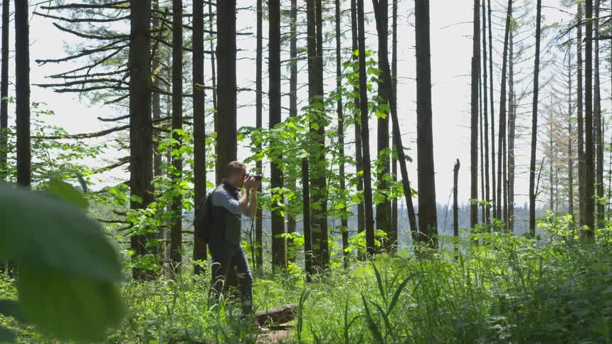 Photographer Hiking In Nature