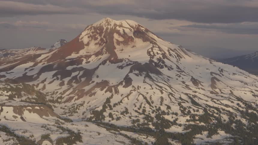Pilot Flying Plane Through Snowy Mountains