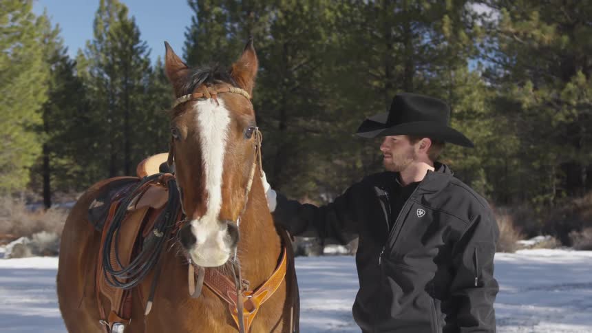 People Riding Horses In Snow