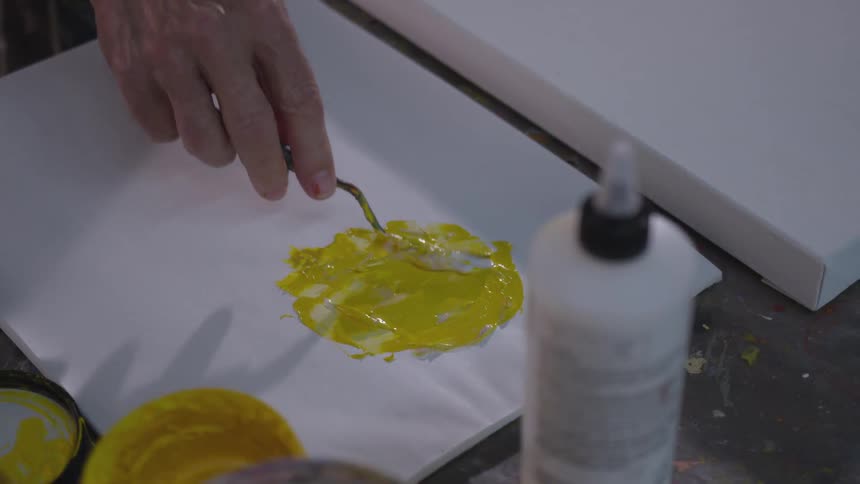 Older Man Painting In Studio