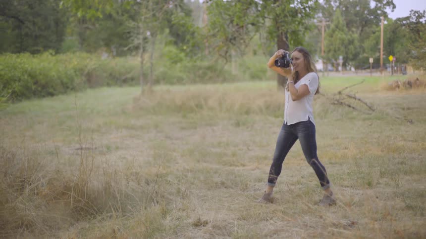 Photographer Taking Pictures Of Woman