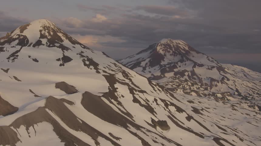 Pilot Flying Plane Through Snowy Mountains