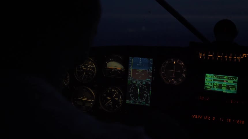 Pilot Flying Plane Through Snowy Mountains
