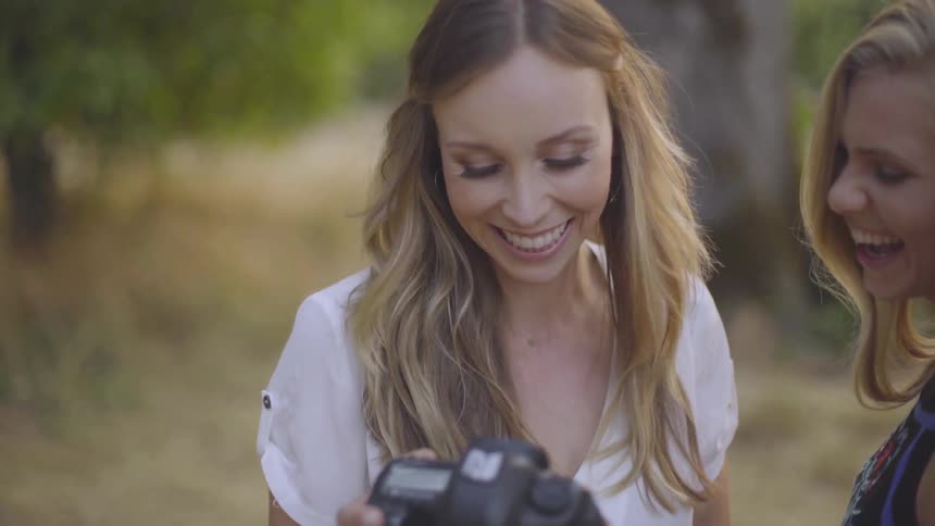 Photographer Taking Pictures Of Woman
