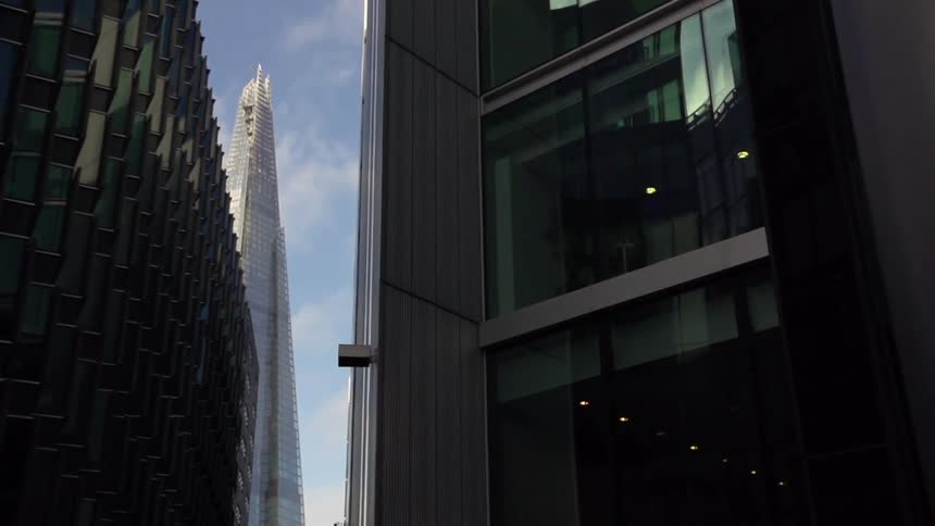 View of some very tall buildings on a cloudy day
