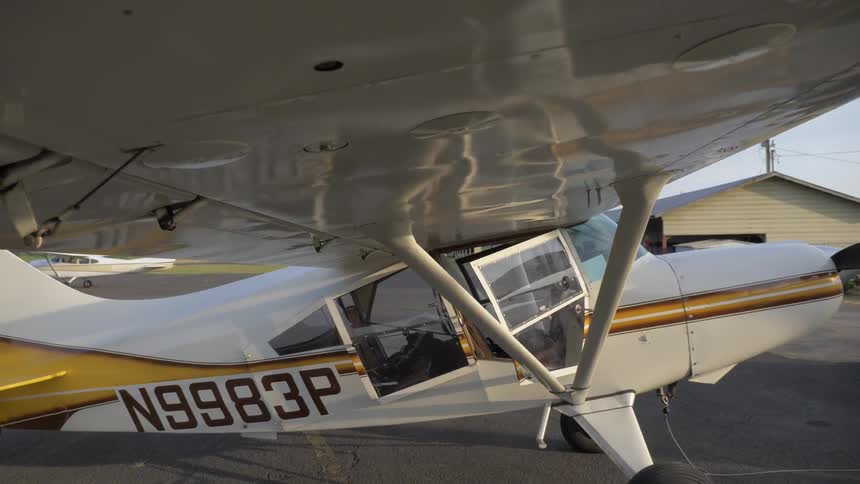 Pilot Flying Plane Through Snowy Mountains