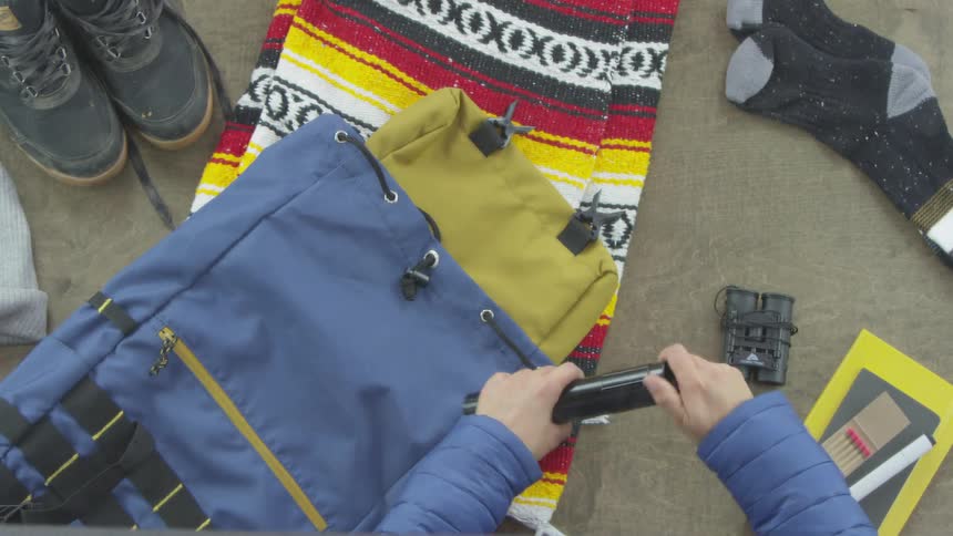 Person Packing For Camping Trip