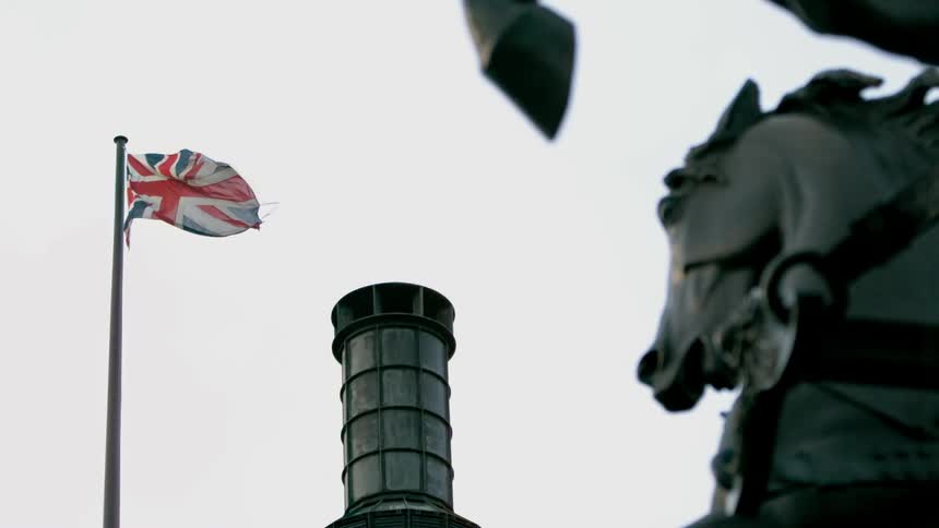 Flag flights high in a cloudy sky