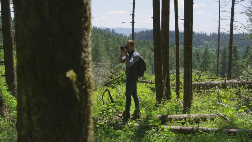 Photographer Hiking In Nature