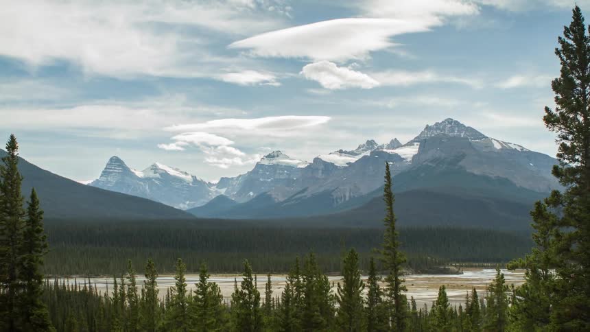 Clouds floating over mountains