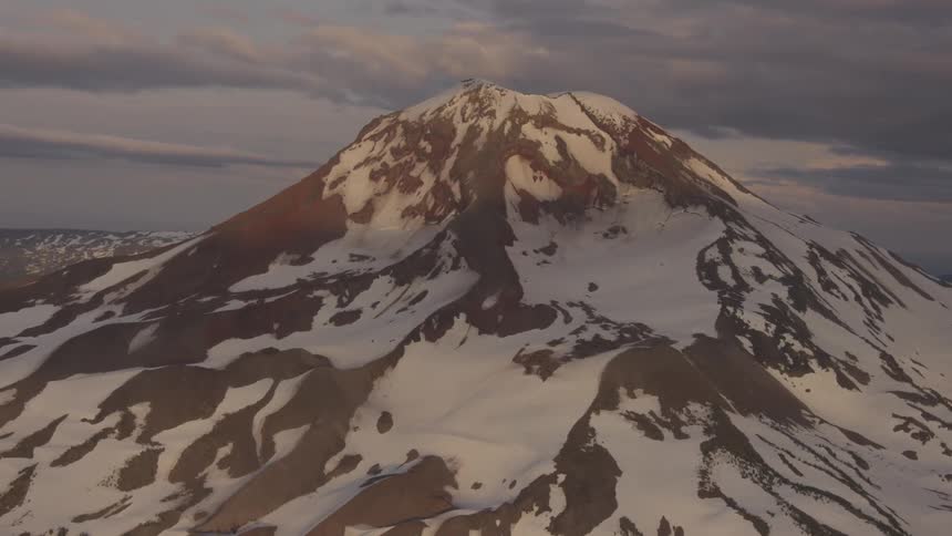 Pilot Flying Plane Through Snowy Mountains