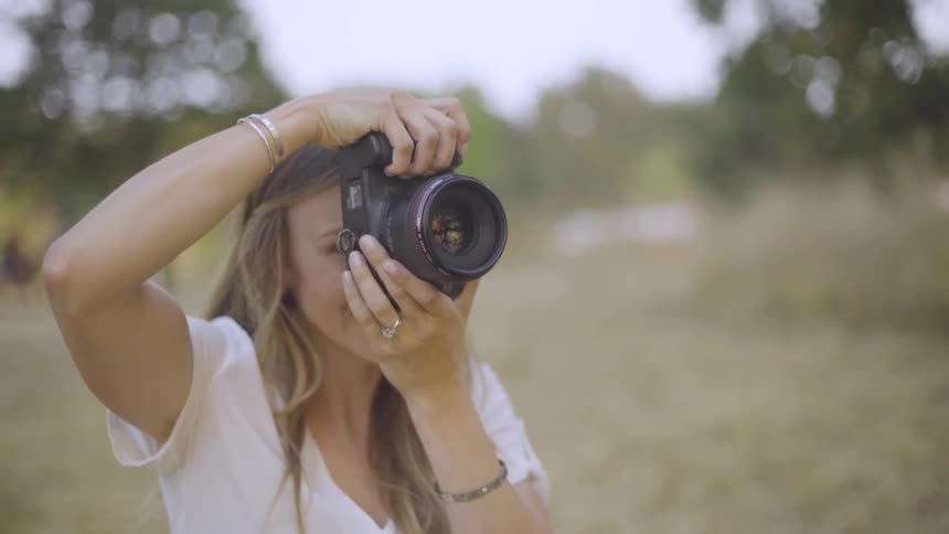 Photographer Taking Pictures Of Woman
