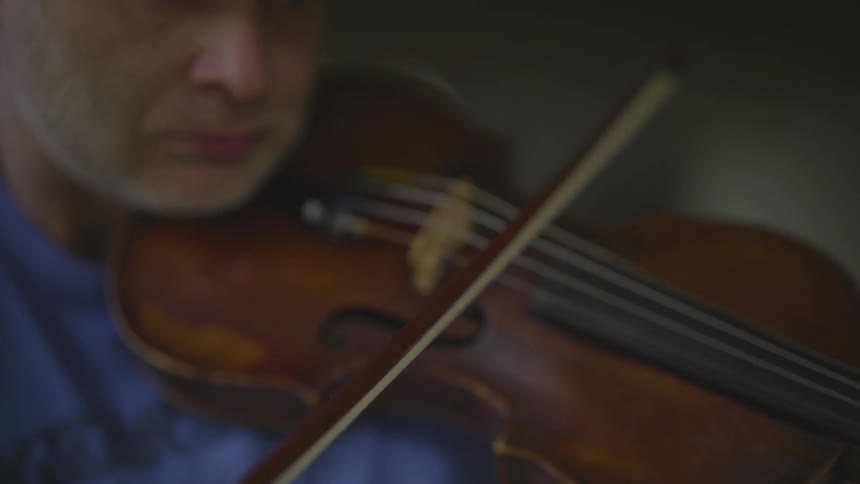 People Playing Violin