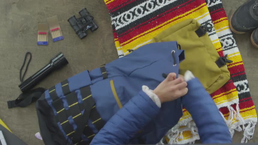 Person Packing For Camping Trip