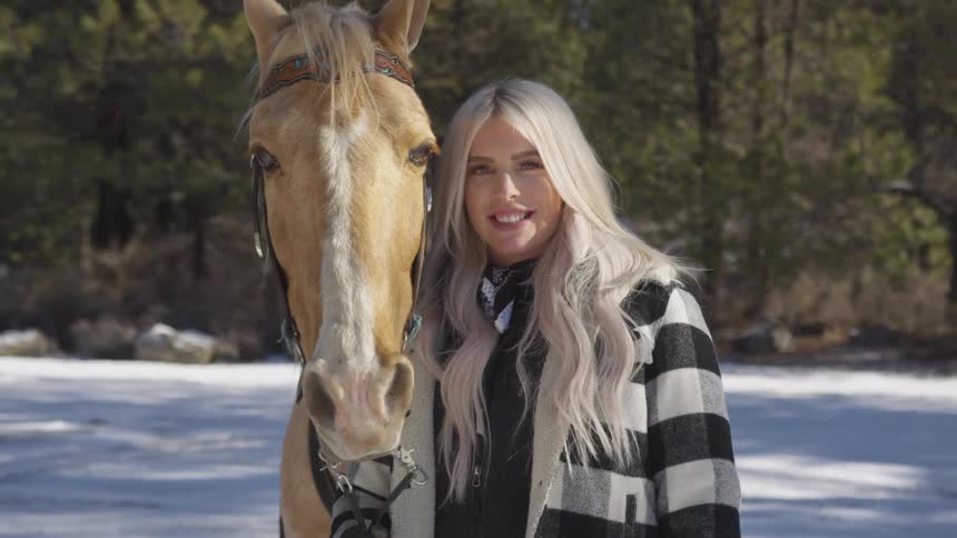 People Riding Horses In Snow