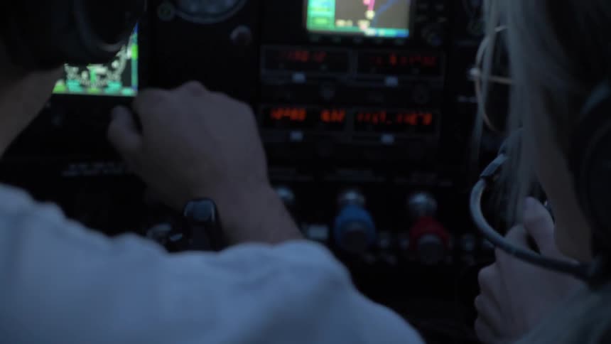 Pilot Flying Plane Through Snowy Mountains