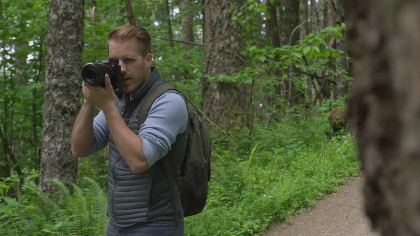 Photographer Hiking In Nature