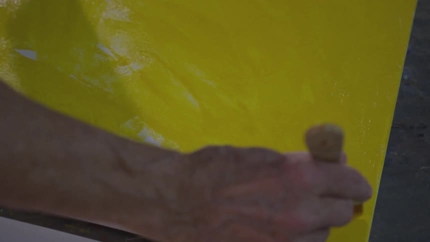 Older Man Painting In Studio