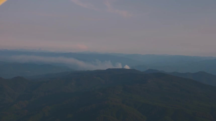 Pilot Flying Plane Through Snowy Mountains